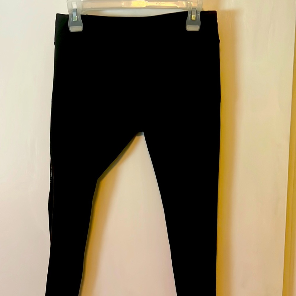 KiraGrace black leggings size medium. Never worn with mesh siding from hip down.
